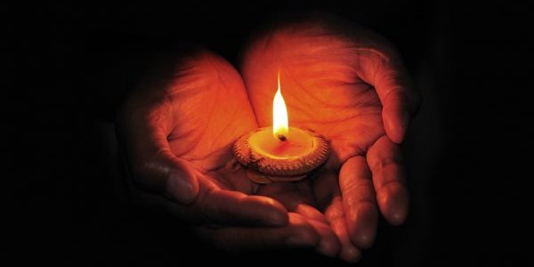 depositphotos_28375075-stock-photo-burning-candle-in-hand